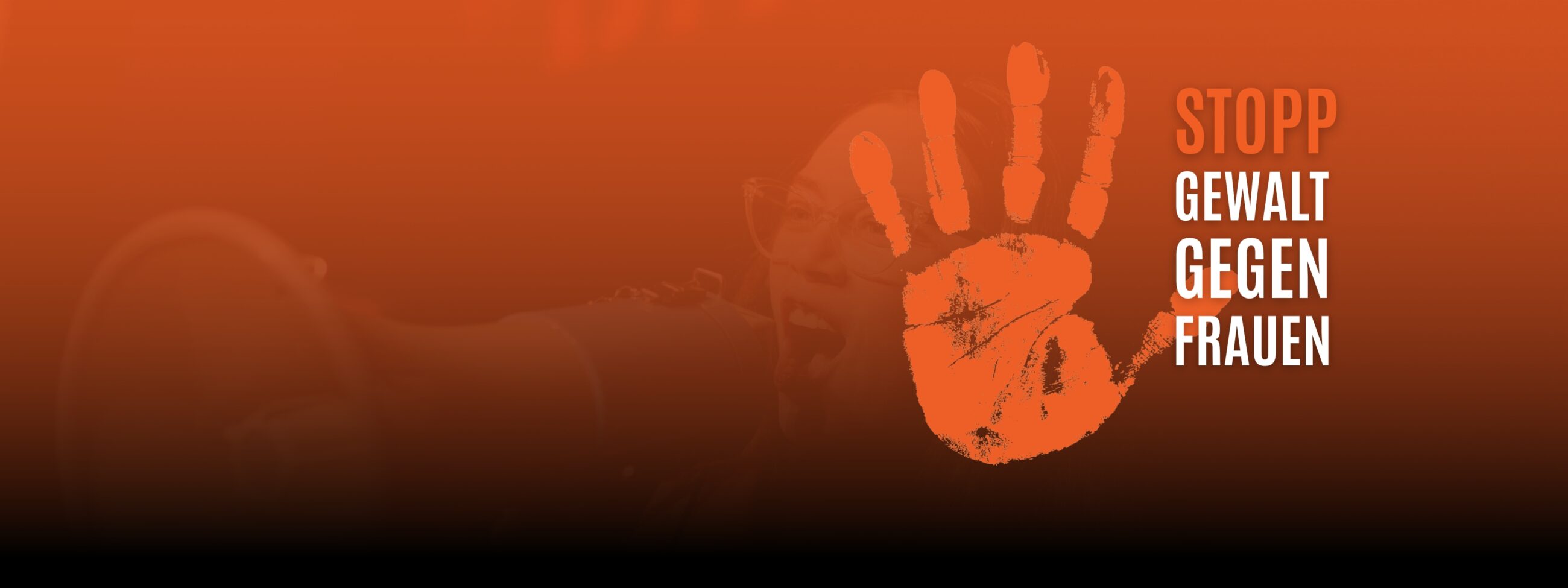 Orange The World Logo - orangefarbener Handabdruck